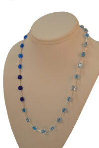 Blue and clear beads necklace by Beth Knipstein