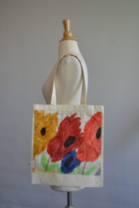 Flowers and Suns tote by Maria Fulchino