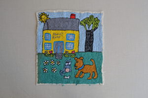 Family Home embroidery by Mary DeCesar
