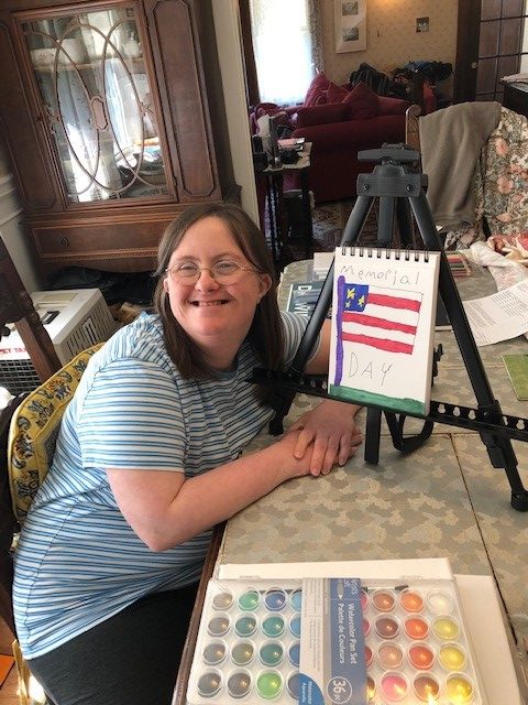 Beth Knipstein with a Memorial Day drawing in her home workspace